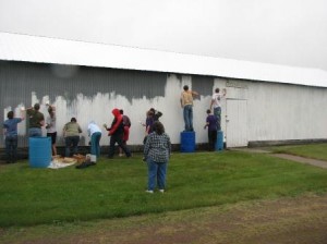 Junior leaders paint barn at fairgrounds