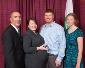 Beth and Mark Heinze accept the 4-H Hall of Fame award on behalf of Dr. Dickson, with Wisconsin 4-H Youth Development Program Director Dale Leidheiser and Wisconsin 4-H Youth Leader Council President Pauline Schlais