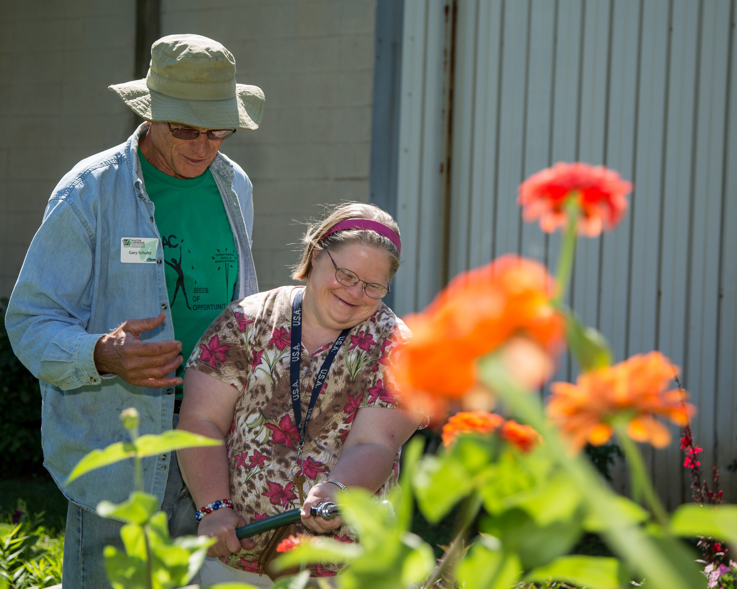 adult with special needs and Master Gardener volunteer